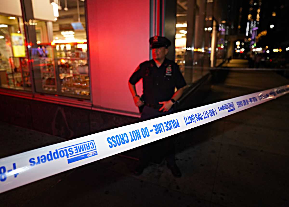 Police at a shooting scene in Queens.