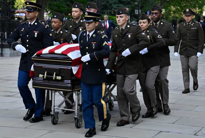 Honor guard escorts casket carrying Charles Rangel